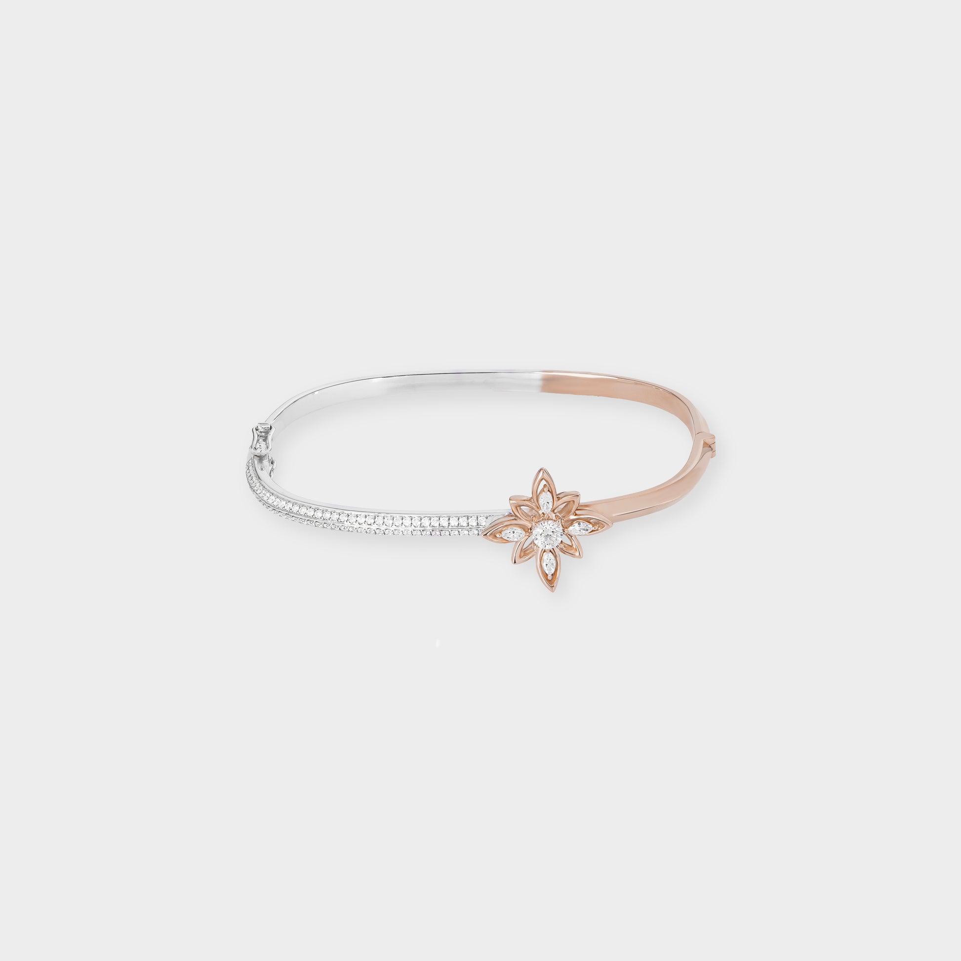 Rose and white bangle with a star-shaped clasp on a light gray background