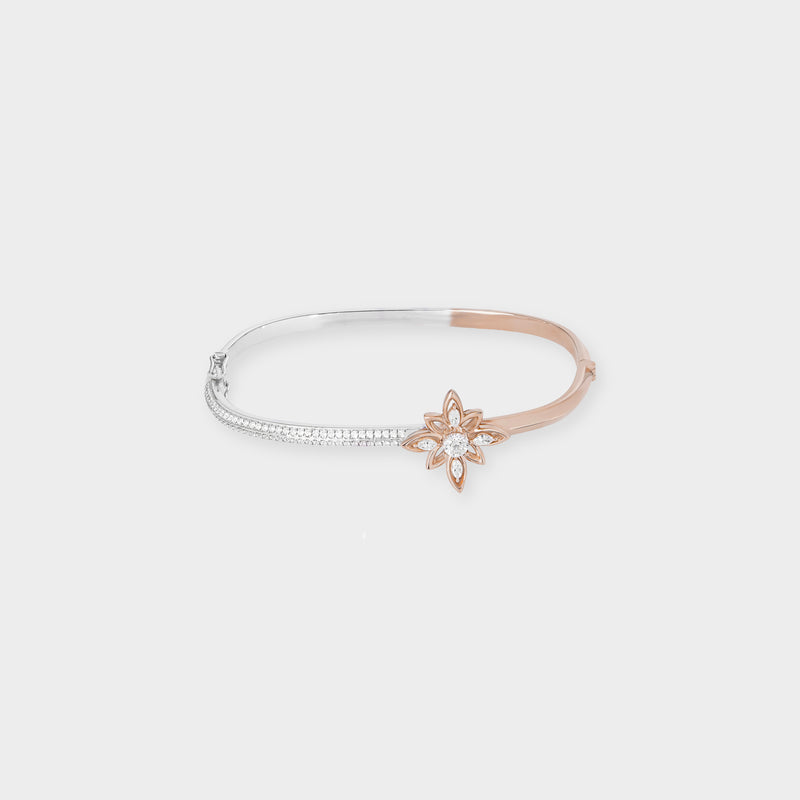 Rose and white bangle with a star-shaped clasp on a light gray background