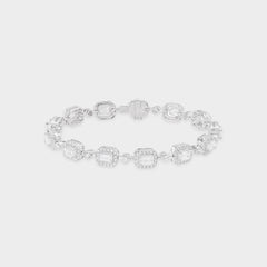 White gold bracelet with clear emerald-shaped diamond on a light gray background