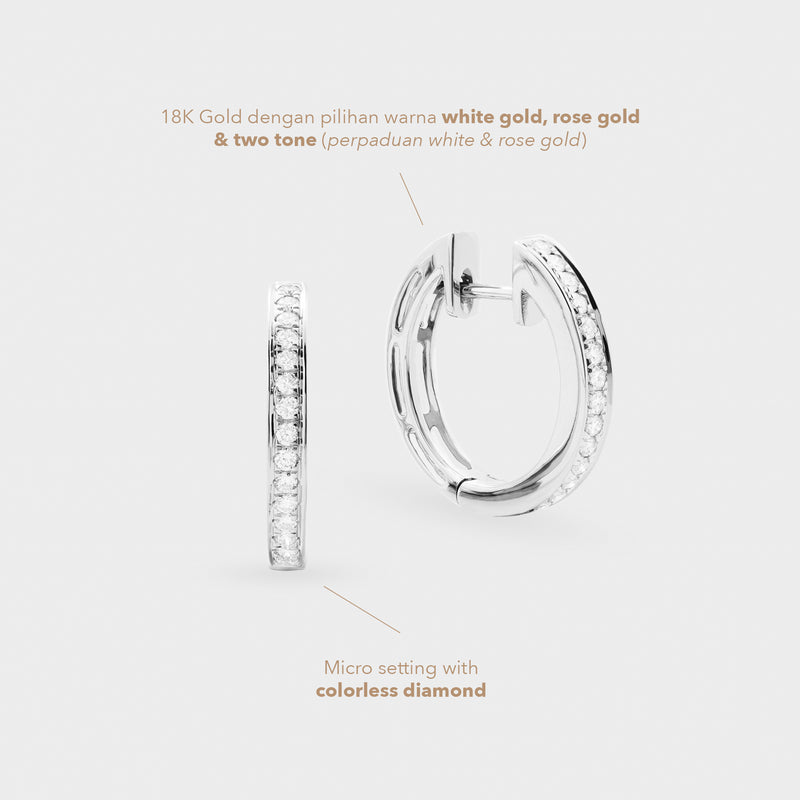 Pair of hoop earrings with diamond accents on a light gray background